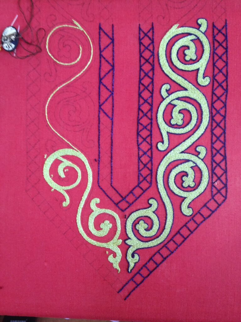 Finished up the last green spiral where the embroidery sits now. Threaded up the needle to finish up the purple so I can advance it to the next bit.